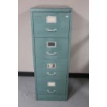 A metal four drawer filing cabinet