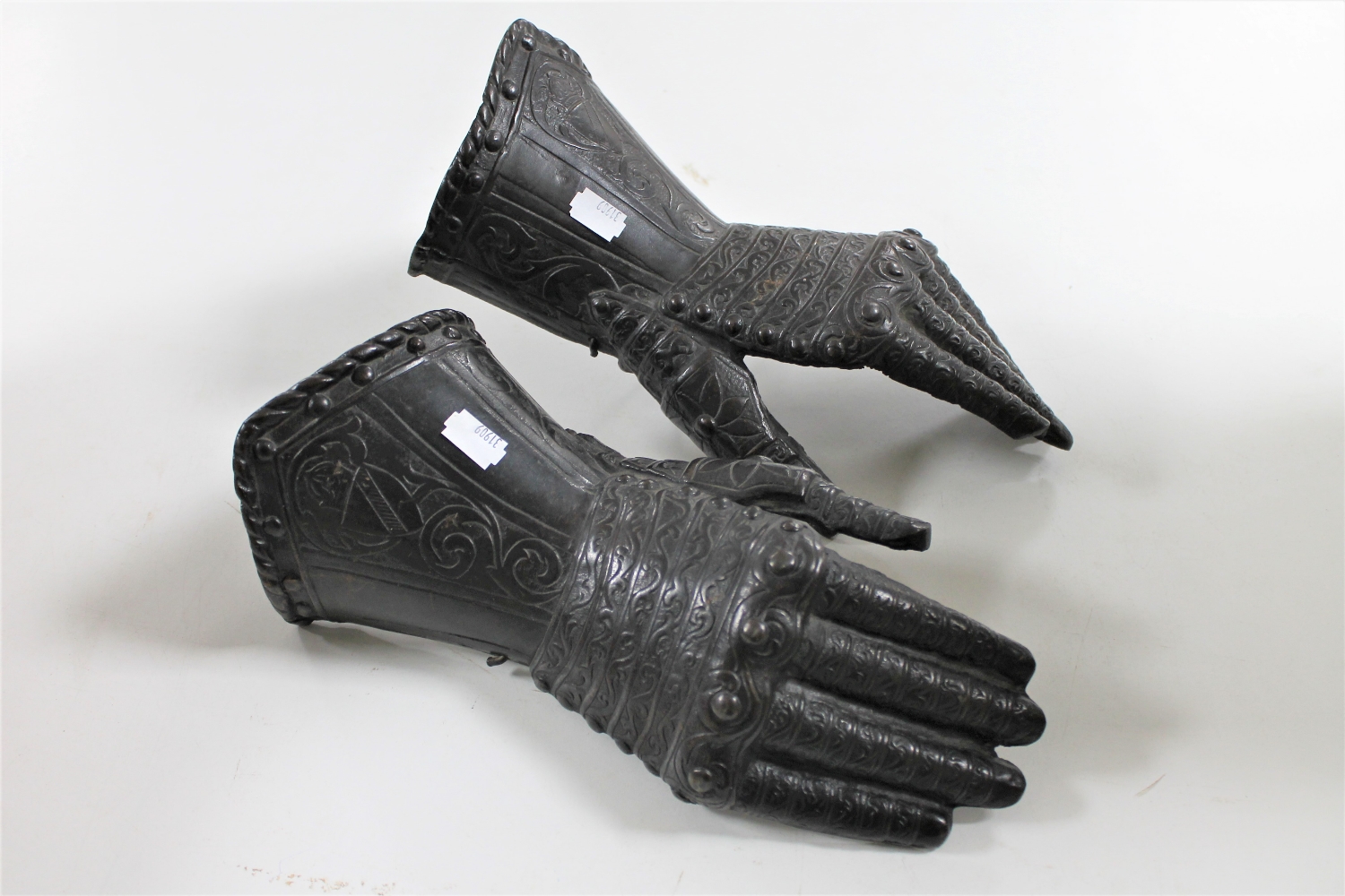 A pair of cast metal ornamental gauntlets