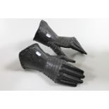 A pair of cast metal ornamental gauntlets