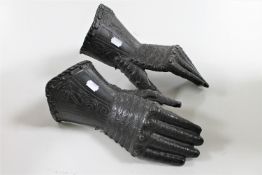 A pair of cast metal ornamental gauntlets