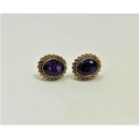 A pair of 9ct gold amethyst earrings CONDITION REPORT: 3.2g. One missing its fitting.