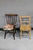 A spindle back kitchen chair and another chair