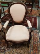 A pair of Victorian style mahogany salon chairs,