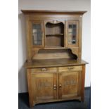 An antique continental oak kitchen dresser