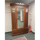 A late Victorian mahogany mirror door wardrobe,