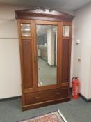 A late Victorian mahogany mirror door wardrobe,