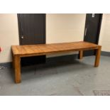 A large hardwood plank topped dining table, 100 cm x 277 cm.