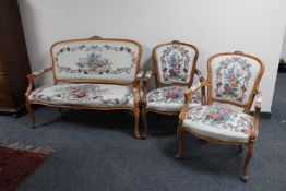 A three piece beech framed salon lounge suite in tapestry fabric