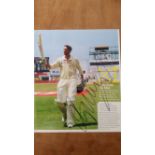 CRICKET, signed colour magazine photo by Jason Gillespie, full-length walking off after scoring