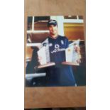 CRICKET, signed colour photo by Michael Vaughan, half-length holding Man of the Series trophy