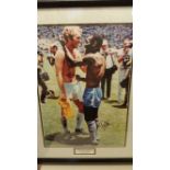 FOOTBALL, signed large colour photo by Pele, showing Pele & Bobby Moore swapping shirts after