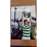 FOOTBALL, signed 12 x 15 photo Billy Mcneill, holding EC trophy above head, partial colour,