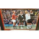 FOOTBALL, signed colour photo by Bobby Charlton & Tony Currie, showing them full-length at coin-toss
