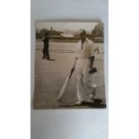 CRICKET, press photo, Australian, showing Johnson full-length with bat in training and Bradman in