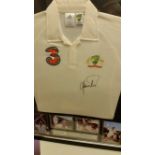 CRICKET, signed replica shirt by Shane Warne, attractively mounted with action photos from his