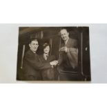 CRICKET, press photo of Chipperfield, showing him on train receiving boxing gloves from Al Burke,