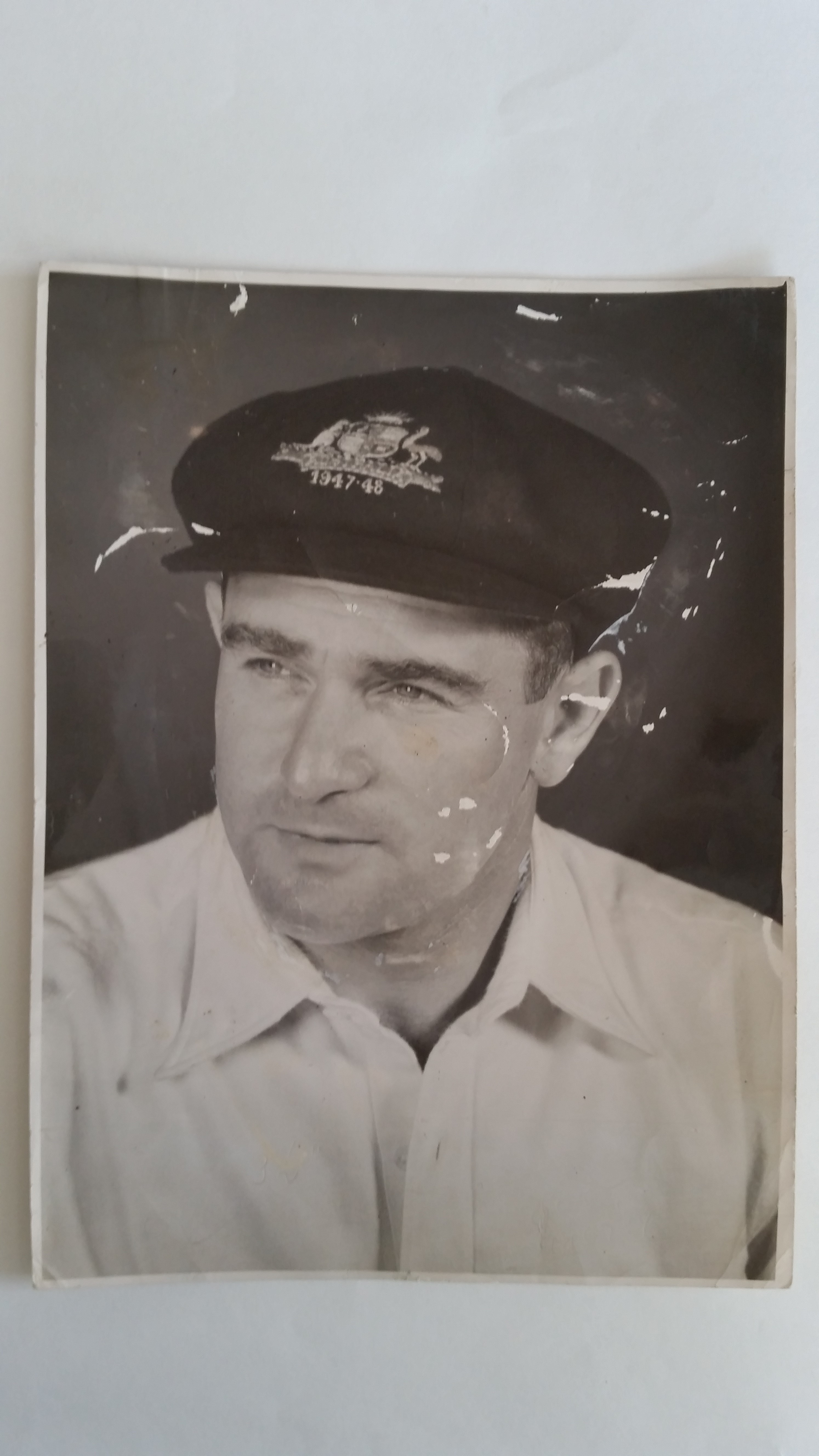 CRICKET, press photo, Sid Barnes, h/s in Australia cap, newspaper cutting laid down to reverse, 6