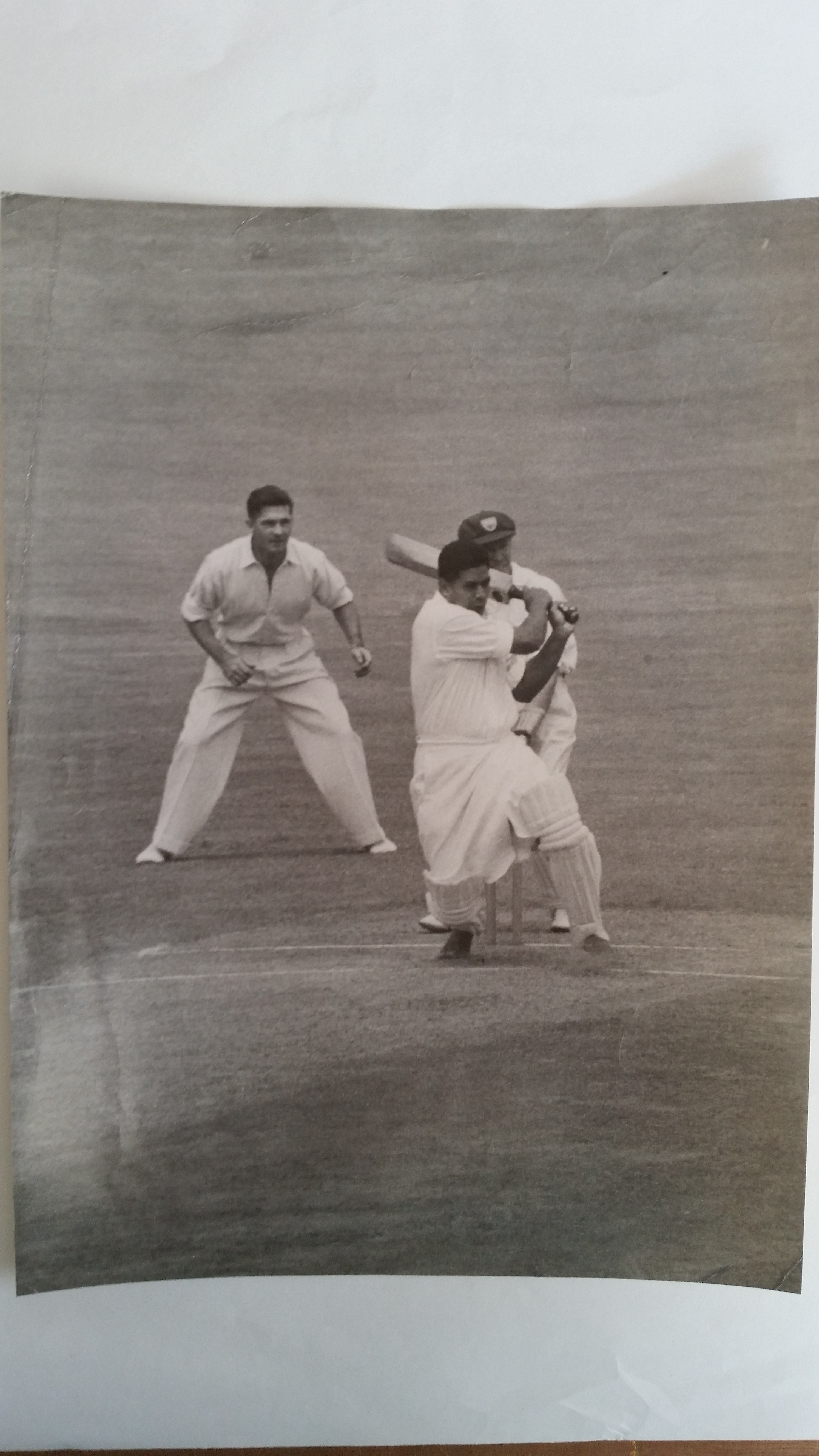 CRICKET, press photo, Neil Harvey, in action fielding, 8.5 x 11.5, creasing, tape marks, about G