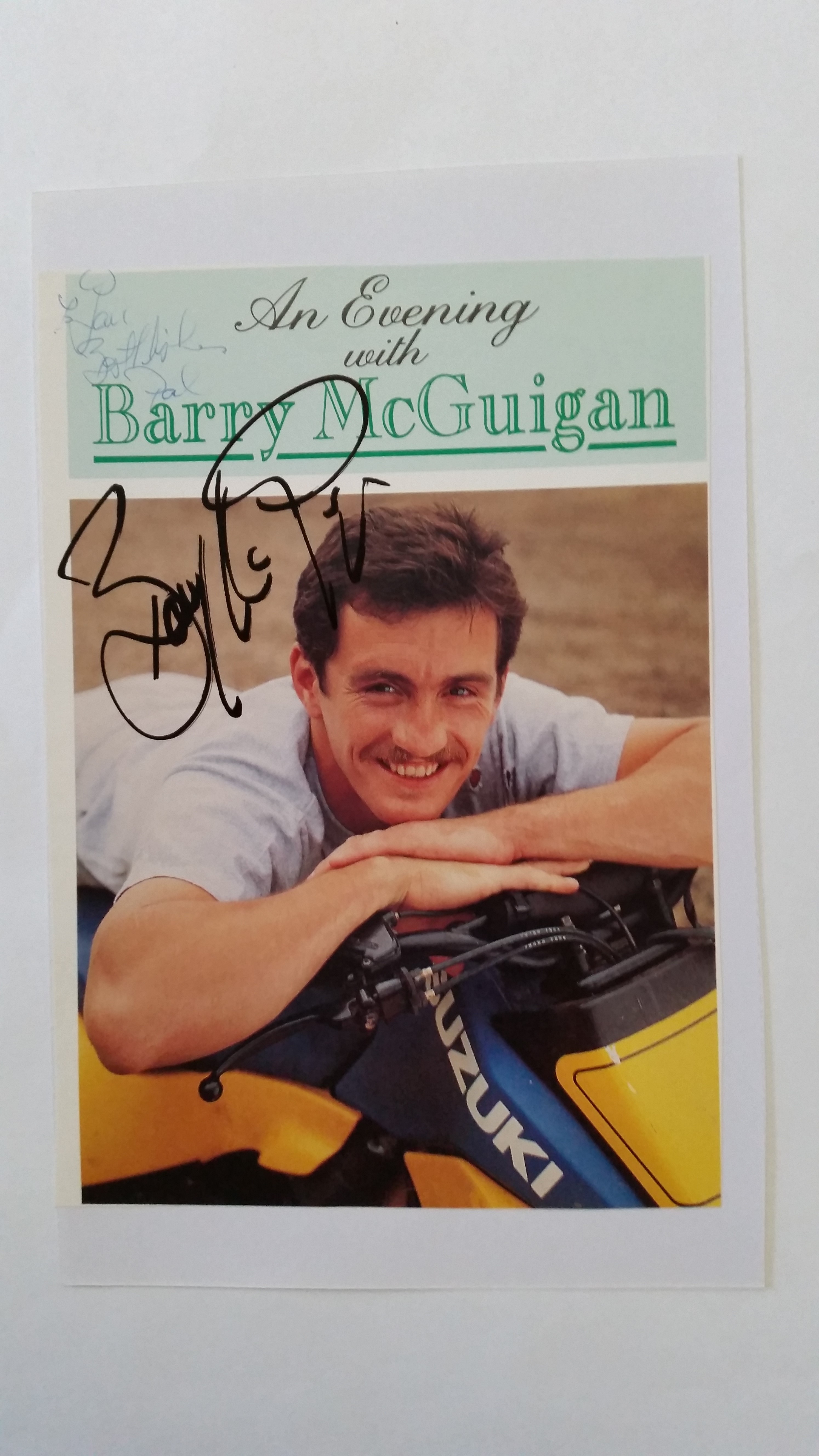 BOXING, signed magazine photo by Barry McGuigan, laid down to card, showing him leaning on