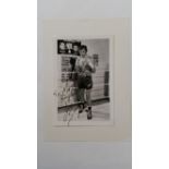 BOXING, signed photo by Joe Bugner, corner-mounted to card showing him in boxing pose, inscribed,