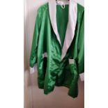 BOXING, a green replica boxing robe, signed by Joe Frazier, with photograph of the signing