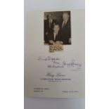 BOXING, signed compliment slip by Harry Levene, laid down to card beneath photo showing him watching