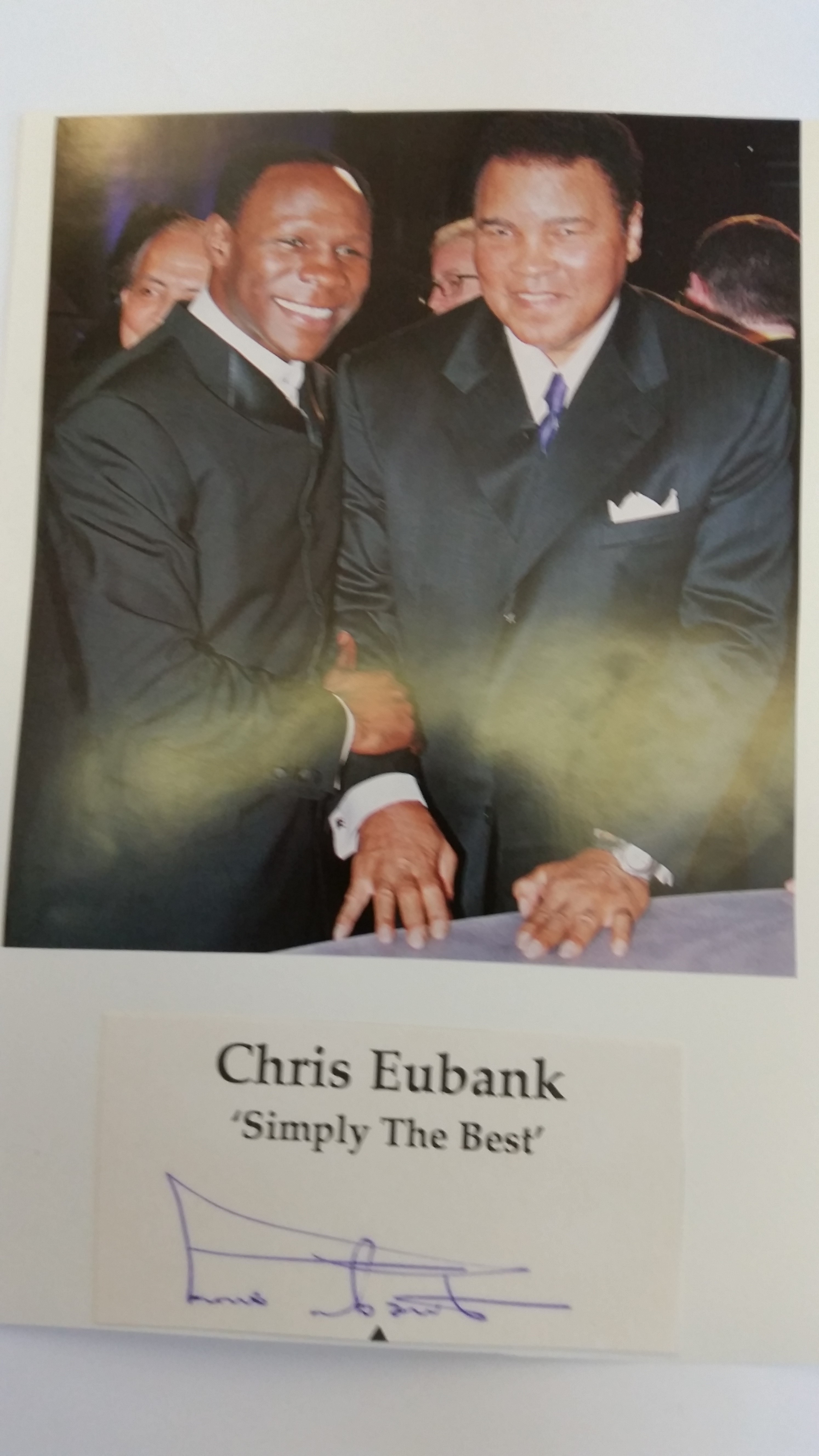 BOXING, signed piece by Chris Eubank, laid down to card beneath magazine photo showing him half-