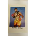 BOXING, signed promotional card by Thomas Hearns, laid down to card showing him three-quarter length