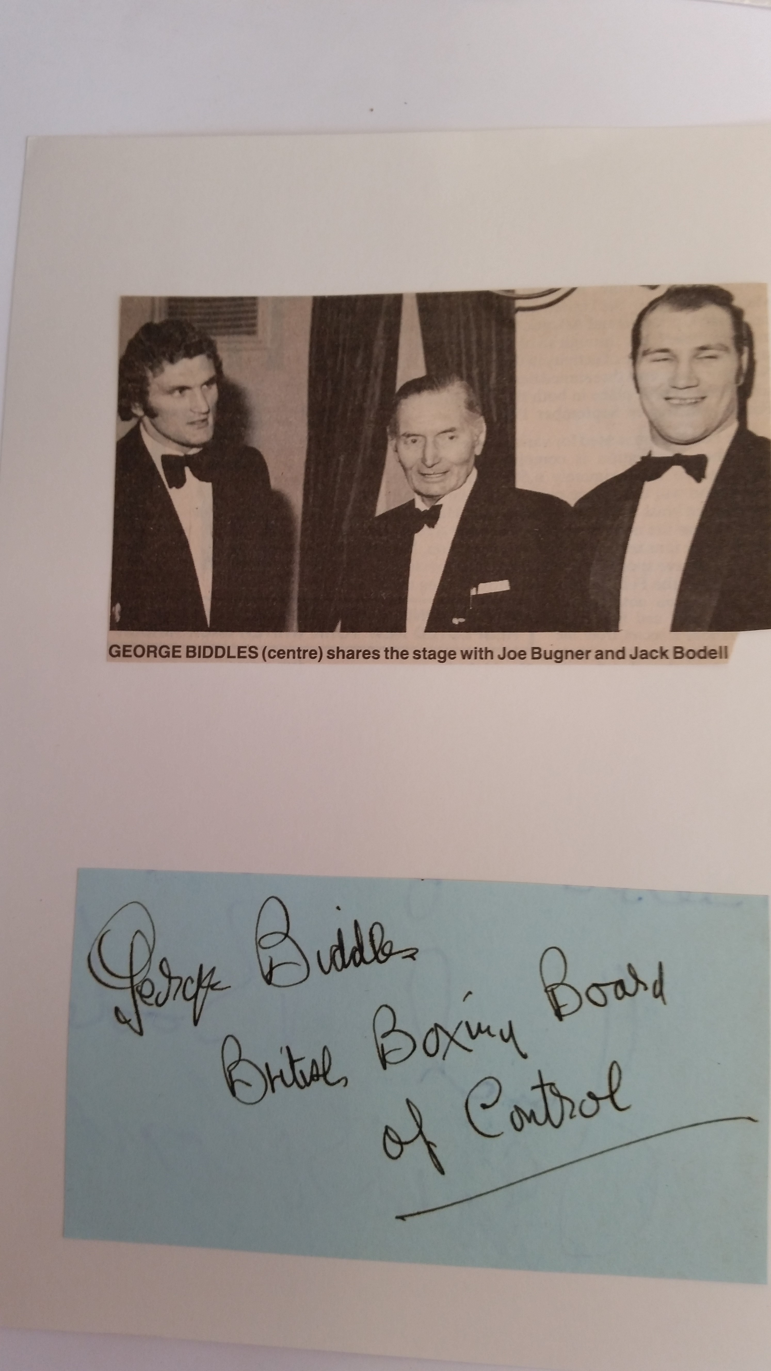 BOXING, signed piece by George Biddles, laid down to card beneath newspaper photo showing him with