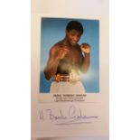 BOXING, signed piece by Herol 'Bomber' Graham, laid down to card beneath promotional card showing