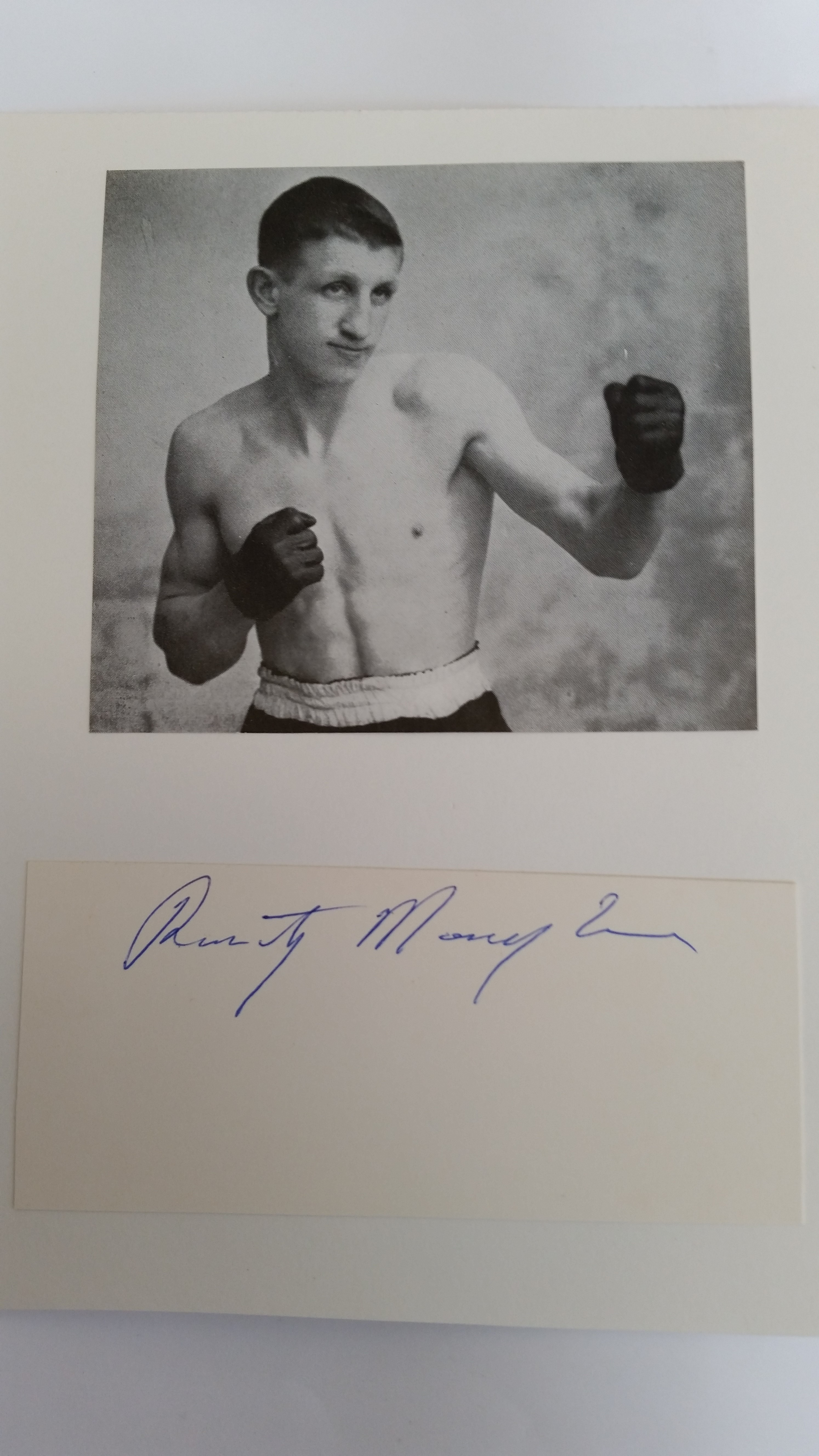 BOXING, signed piece by Rinty Monaghan, laid down to card beneath magazine photo showing him half-