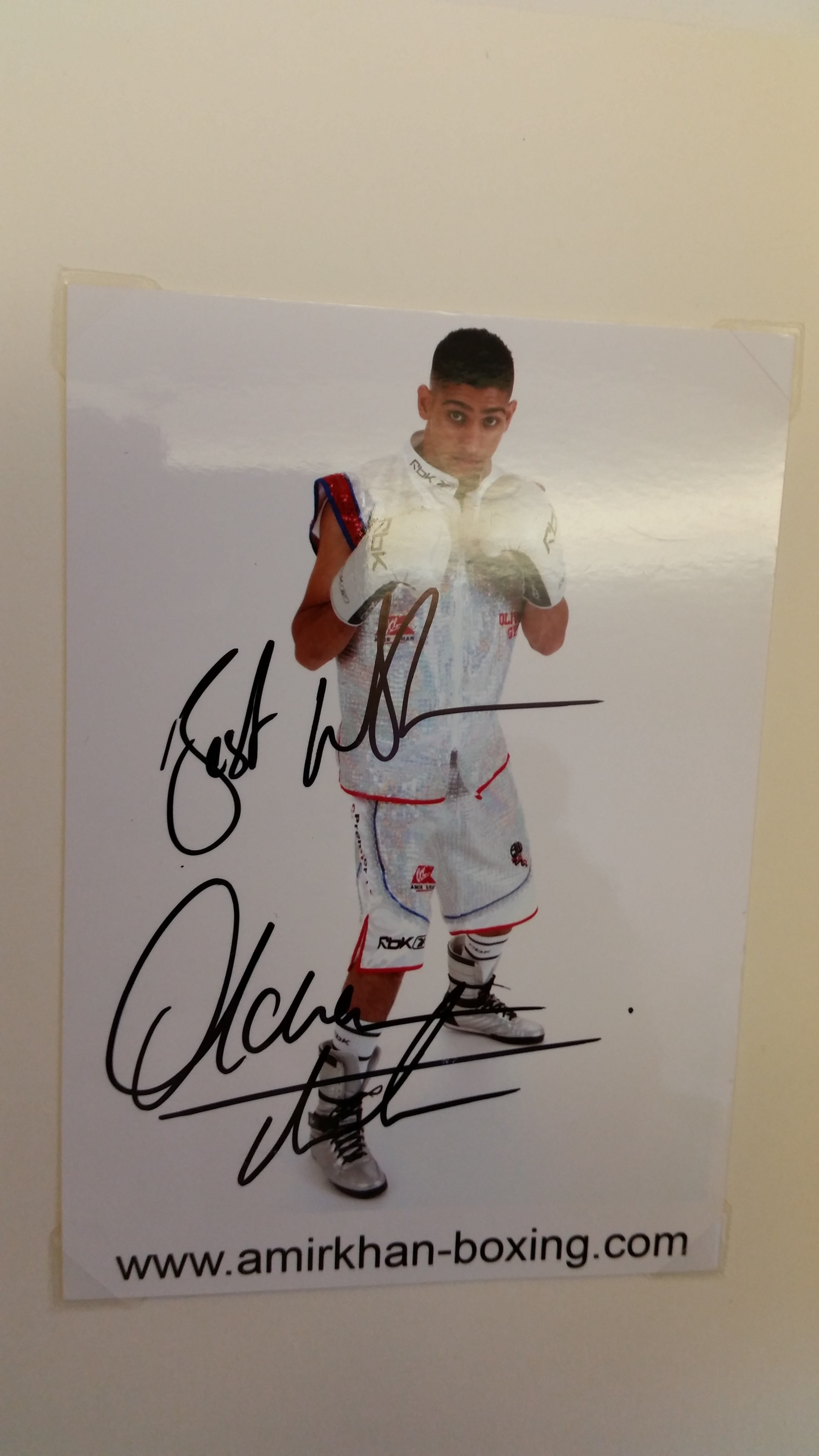 BOXING, signed promotional card by Amir Khan, corner-mounted to card showing him full-length in