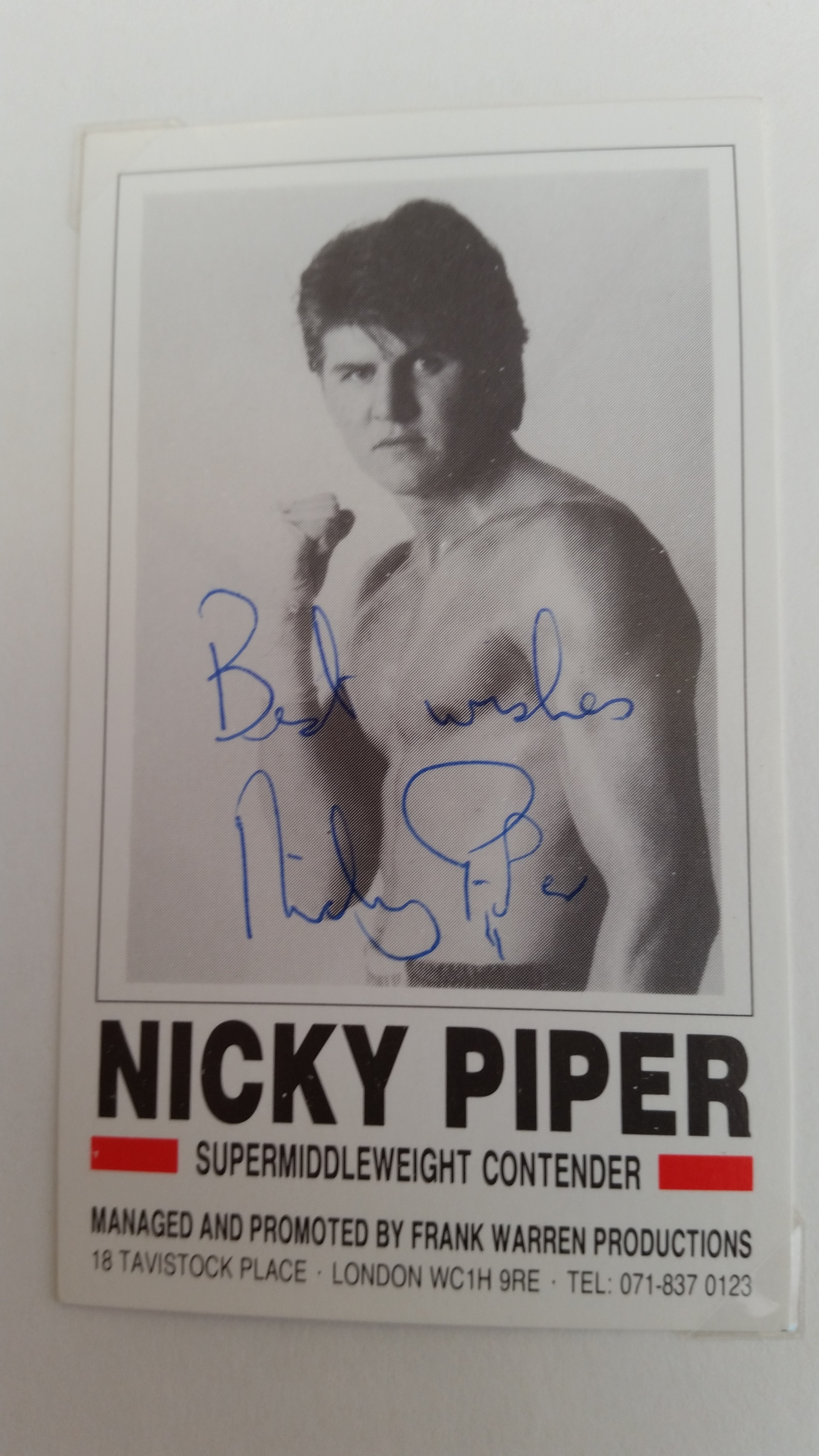 BOXING, signed promotional card by Nicky Piper, corner-mounted to card showing him half-length in