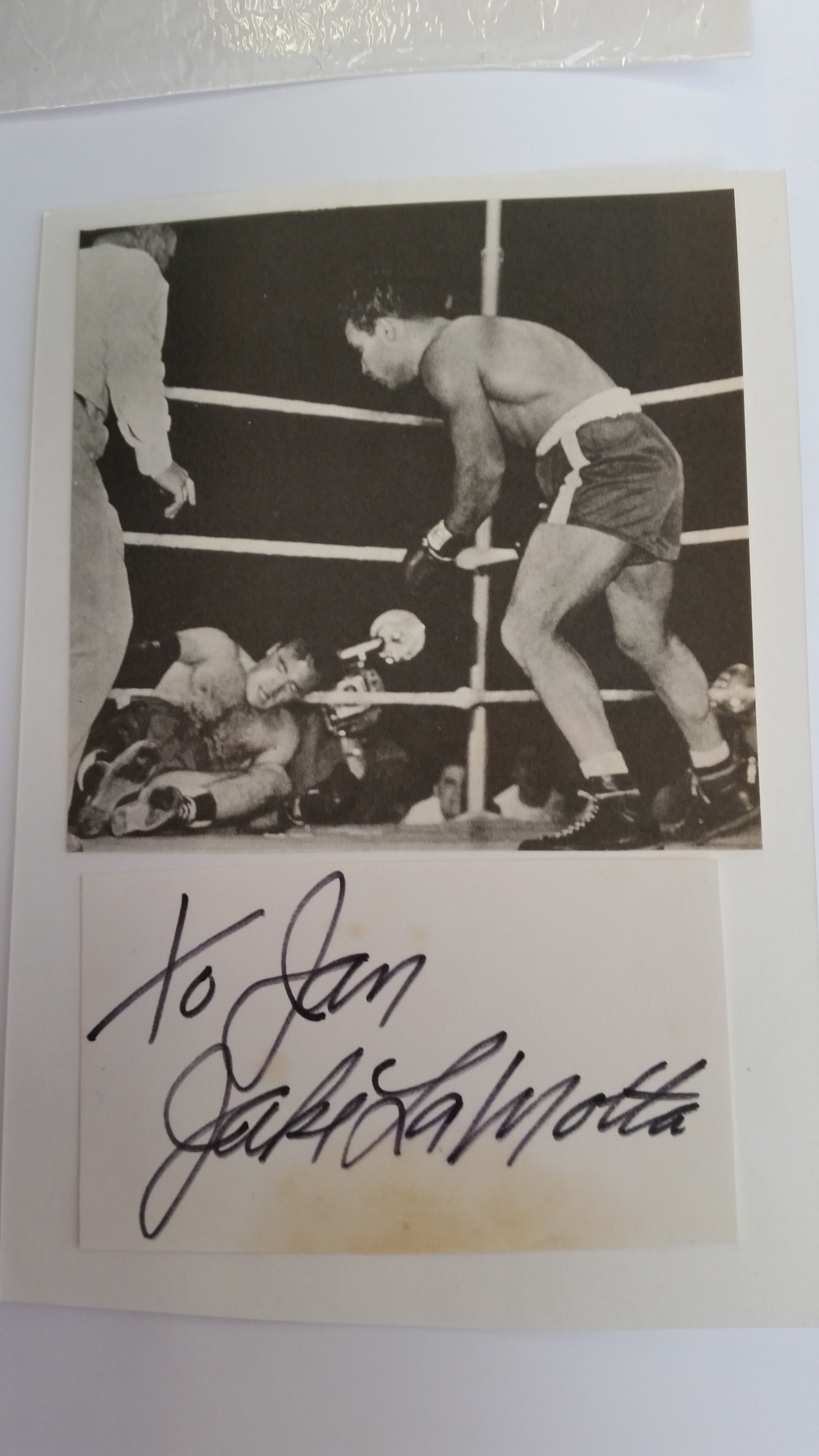 BOXING, signed and inscribed piece by Jake La Motta, laid down to card beneath magazine photo