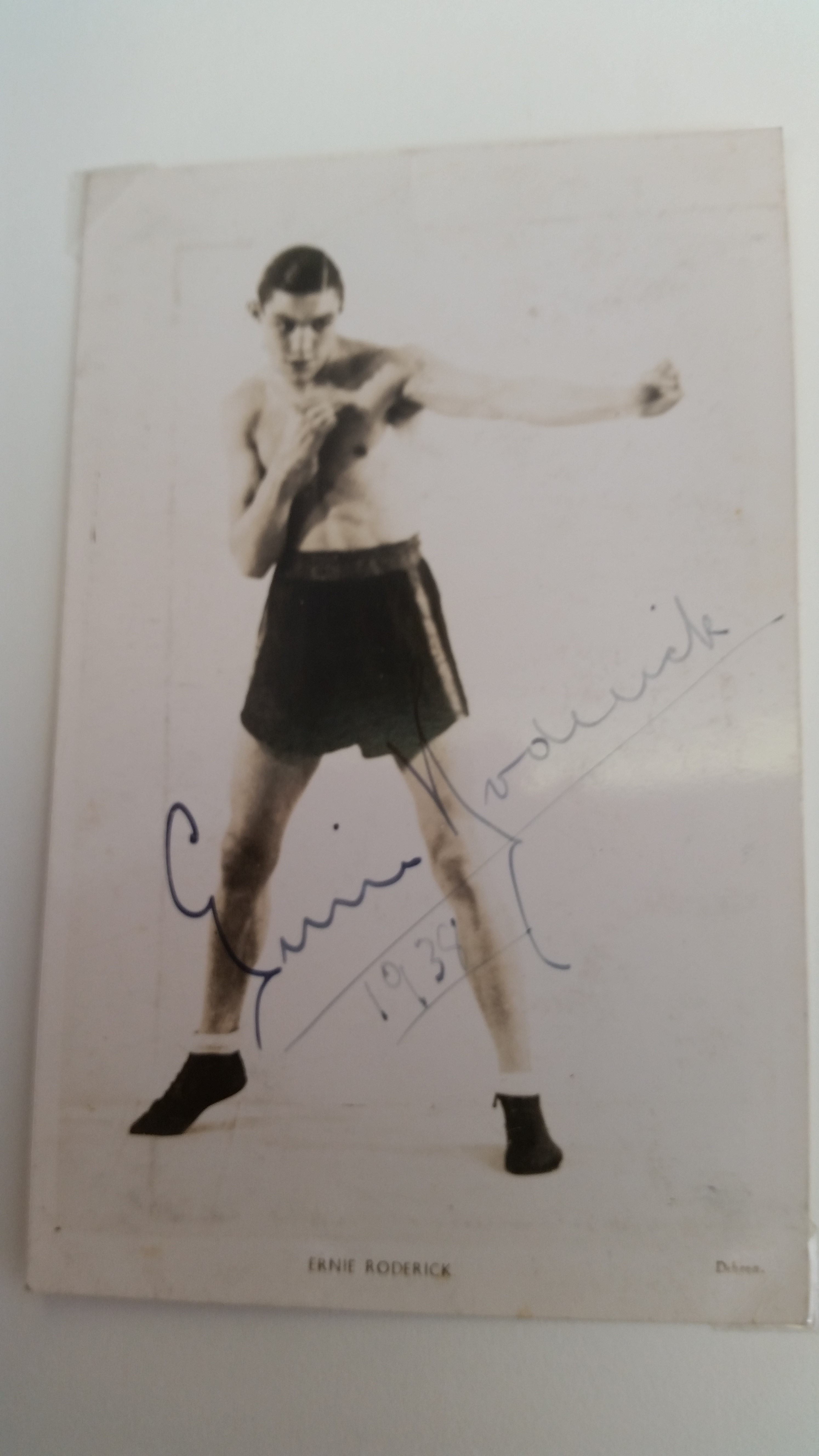 BOXING, signed p/c by Ernie Roderick, corner-mounted to card showing him full-length in boxing pose,