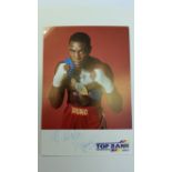 BOXING, signed promotional card by Frank Bruno, corner-mounted to card showing him half-length in