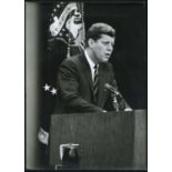 PHOTOGRAPHS. Two black and white press photographs of President John F. Kennedy, each 25.5cm x 18.