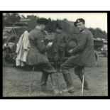 PHOTOGRAPHS. A collection of approximately twenty-four photographs of a military unit in the early