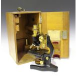 A 20th century black enamelled and lacquered brass binocular microscope, signed 'Ernst Leitz