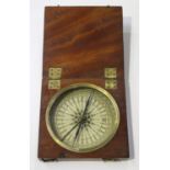 An early 19th century mahogany cased compass with printed paper dial and blued steel needle, the