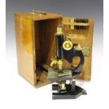 A late 19th century black enamelled and lacquered brass monocular microscope, by R & J Beck Ltd of
