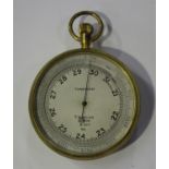 An early 20th century gilt brass cased pocket barometer, the silvered dial detailed 'T. Wheeler