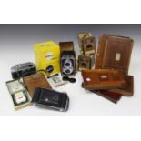 A Halina AI twin lens reflex type camera, cased and boxed, four vintage mahogany plate holders and a