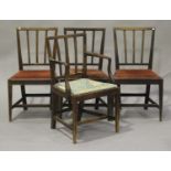 A set of four George III mahogany bar and spindle back dining chairs with drop-in seats,