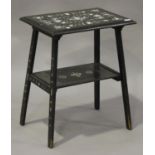 A late 19th century Italian ebonized two-tier occasional table with ivory inlaid decoration, on