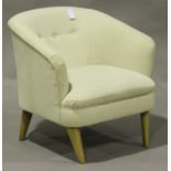 A modern tub back armchair, upholstered in cream fabric, on tapering legs, height 73cm, width 73cm.