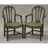 A set of six early 20th century George III style mahogany arched back dining chairs, comprising