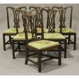 A set of six George III Chippendale period mahogany pierced splat back dining chairs with drop-in