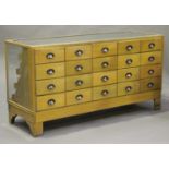 An early/mid-20th century oak framed haberdashery counter, the top with an applied brass measure