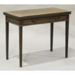 A George II mahogany fold-over tea table, the rectangular top above a single drawer, on square